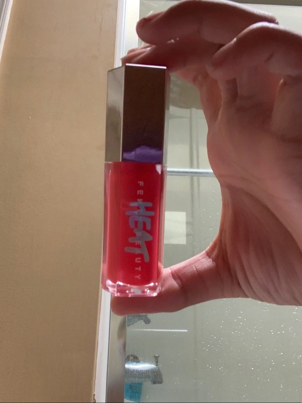 Fenty Beauty Heat Lip Gloss in Bright Red